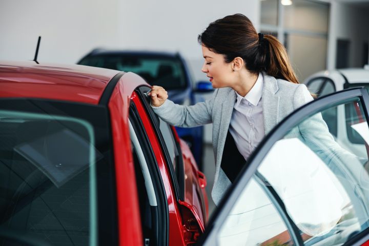 woman entering the car